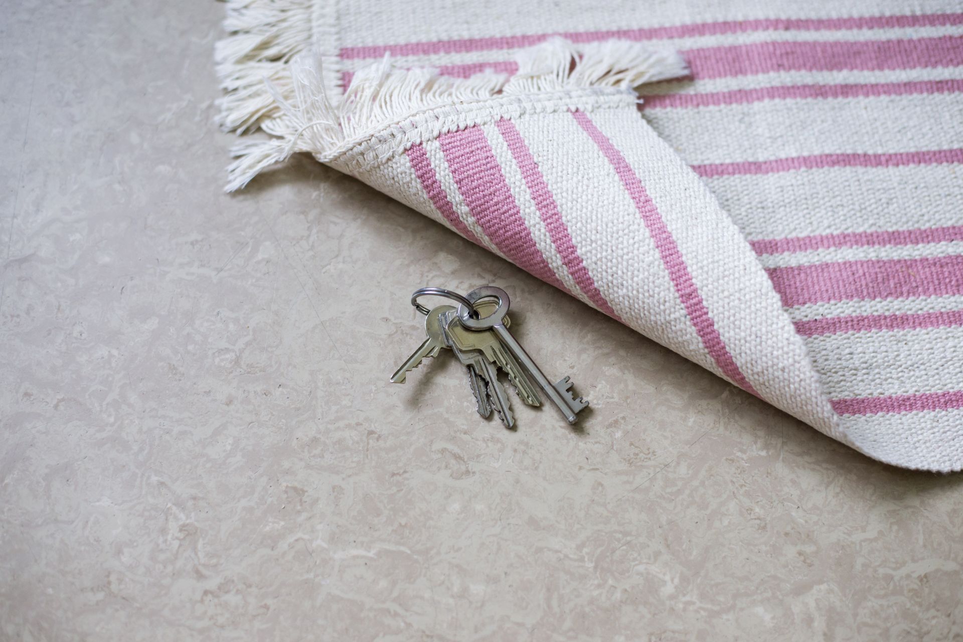 Spare keys under rug