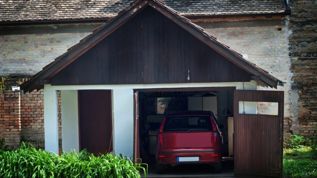 A car parked in a garage, one of the best places to park your car